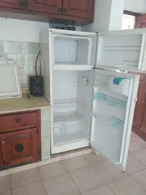 a white refrigerator with its door open in a kitchen at One bedroom apartment in the center with a pool in Sosúa