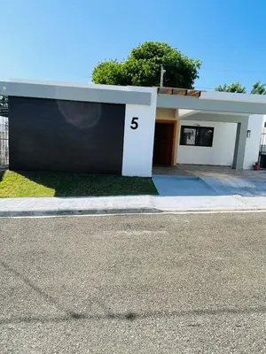 a house with the number on the side of it at Modern 3BR with private pool near the beach in Puerto Plata