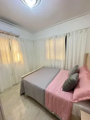 a bedroom with a bed with two pillows on it at Modern and fully equipped house in Samaná in Santa Bárbara de Samaná