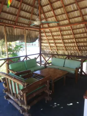 a living room with a couch and a table at Waverider Apartments in Cabarete