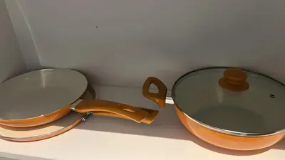 a pot and lid sitting on a counter at Apartment in Punta Cana