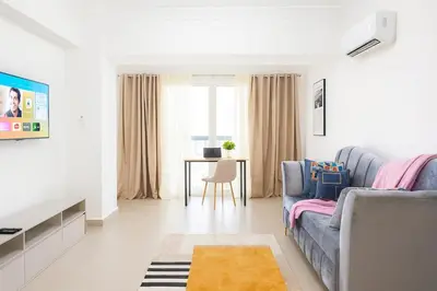 a living room with a couch and a table at Elegant Downtown Stay Santo Domingo in Santo Domingo