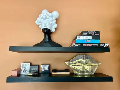 a shelf with a vase and balloons on it at Villa Palmera in Las Terrenas
