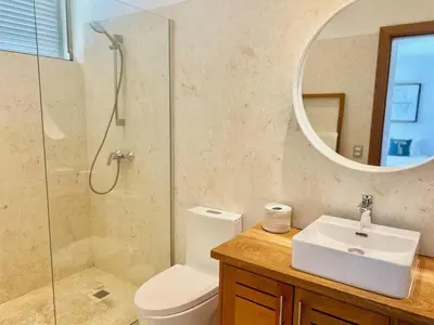 a bathroom with a toilet and a sink and a mirror at Villa Hazel in Las Terrenas