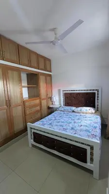 a bedroom with a bed and a ceiling fan at Mitaly apartamentos Santo Domingo G in Santo Domingo