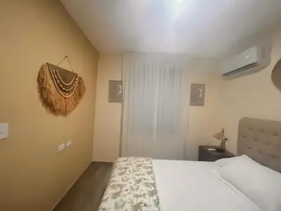 a small bedroom with a bed and a window at El descanso in Higuey