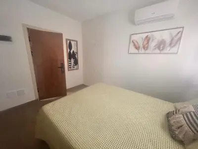 a bedroom with a bed and a door in it at El descanso in Higuey