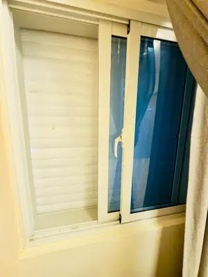 a window with blinds in a room at Luxurious 4 bedroom apartment near the beach in Ensanche Savica de Mendoza