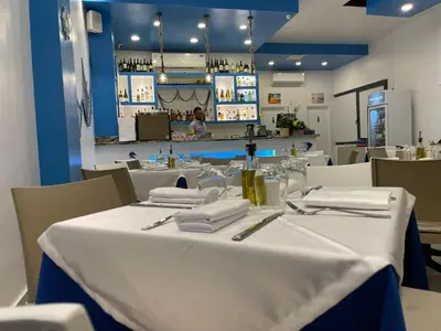 a table in a restaurant with a white table cloth at Ristorante simaredo in Punta Cana