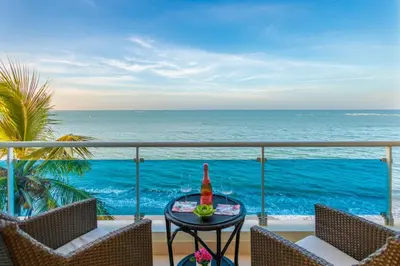 a balcony with a view of the ocean at Cozy Beach Front Apt, King Bed. in Cabarete