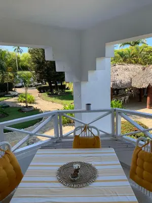 a view of a balcony with a table and chairs at Karibisches Familienparadis in Gated Comunity in Sosua