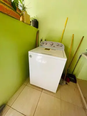 a small white stove in a green room at 360 View House with Private Pool Jacuzzi and Terrace in Puerto Plata
