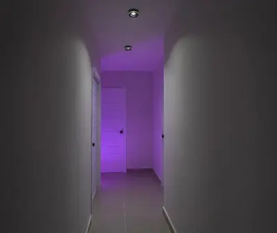 a hallway with a purple ceiling and a white door at San Isidro Urban suite in Juan López
