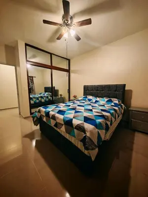 a bedroom with a bed and a ceiling fan at Cozy apartment, AC, Wifi, 2 Bedroom, 2 bath, Bani, 1-A in Baní