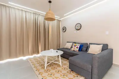 a living room with a couch and a table at Caribey 200 meters from Punta Popy beach in Las Terrenas