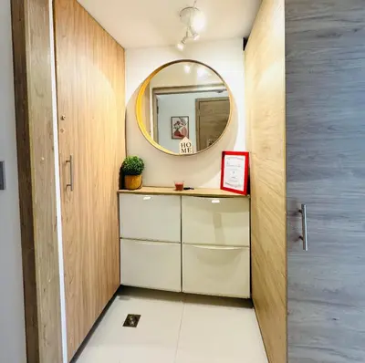 a dressing room with a mirror and a cabinet at Modern Central Ocean View and Jacuzzi Apartment in Santo Domingo