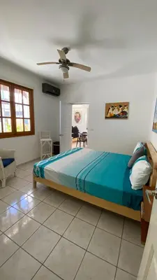 a bedroom with a bed and a ceiling fan at Casa Mattia in La Laguna