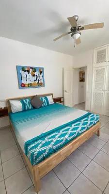 a bed in a bedroom with a ceiling fan at Casa Mattia in La Laguna
