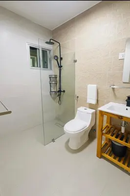 a bathroom with a shower and a toilet and a sink at Boca chica playa y sol in Boca Chica