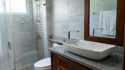 a bathroom with a sink and a toilet and a shower at Eden Caribe Punta Vana in Punta Cana
