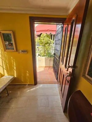 an open door to a room with a patio at Villa Mila en Santo Domingo in Los Tres Ojos de Agua