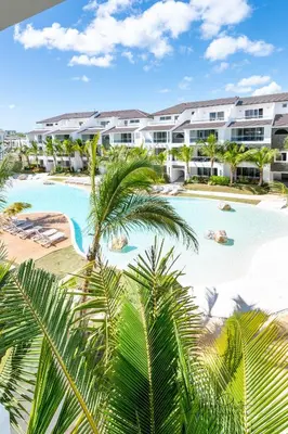 an aerial view of a resort swimming pool with palm trees at Estrella Garden Shaula 301 New Modern Penthouse in La Laguna