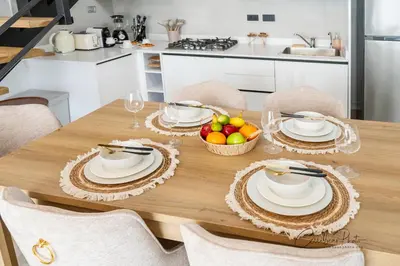 a dining room table with a bowl of fruit on it at Estrella Garden Shaula 304 New Modern Penthouse in La Laguna