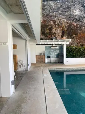a house with a swimming pool in the middle of it at Villa Mirna in Las Terrenas