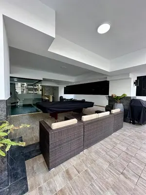 a living room with a ping pong table and couches at Moderno 1 Habitación Cerca Avenida Churchill in Santo Domingo