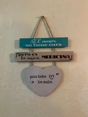 a heart sign on a wall with three signs at Constanza Family House in Constanza