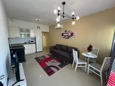 a living room with a couch and a table at Quiet and beautiful view in Boca Chica
