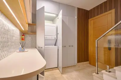 a kitchen with a white counter and a refrigerator at Increíble ático de lujo con impresionantes vistas in Puerto Plata