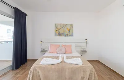 a bedroom with a bed with two towels on it at Luxury 1 BR at Paraiso Residence Bayahibe in Bayahibe