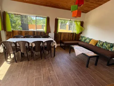 a dining room with a table and chairs at Casa vista hermosa in Camú