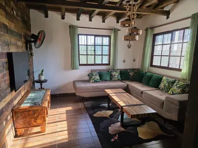 a living room with a couch and a table at Casa vista hermosa in Camú