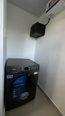 a room with a microwave oven sitting on a wall at Apartamento en La Romana 3 habitaciones in La Romana