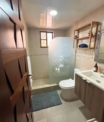 a small bathroom with a toilet and a sink at Apartamento Rosa Hermosa in Punta Cana