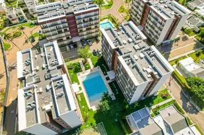 an overhead view of apartment buildings with a swimming pool at Cozy 2BD Condo, Near Beach in San Felipe de Puerto Plata
