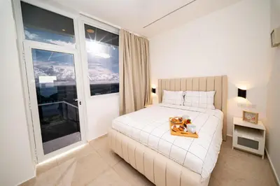 a bedroom with a bed with a tray of food on it at Couples PH @ Cana Rock Star with Great Golf Views in Punta Cana