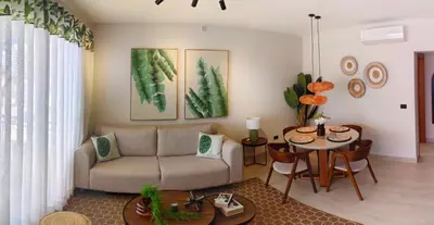 a living room with a couch and a table at Green Oasis in La Laguna