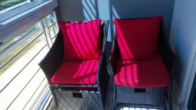 two chairs sitting next to a window on a train at This beautiful apt you can have a nice vacation in Santo Domingo