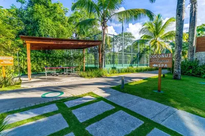a park with a picnic table and a sign at Beachfront Sublime Las Terrenas in Las Terrenas