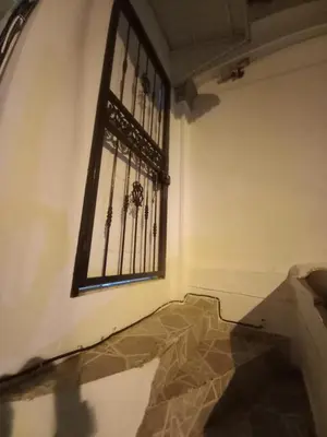 a room with a window with a grate on the wall at Casa Petter and Maria, 2end floor in Santiago de los Caballeros