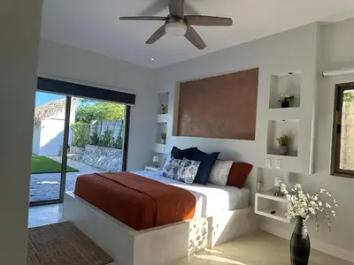 a bedroom with a bed and a ceiling fan at Villa Olam - 9 pax, 4 min de la playa in Las Galeras