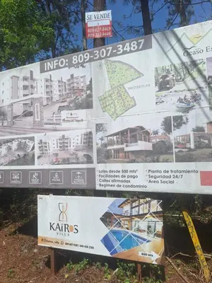 a sign for a building in a city at Caribbean Corner in Jarabacoa