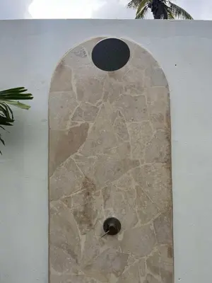 a stone wall with a hole in it at Villa Coral Blue in Playa Bonita in Las Terrenas