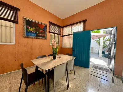 a dining room with a table and chairs at Colonial Home with Private Terrace and Jacuzzi in Santo Domingo