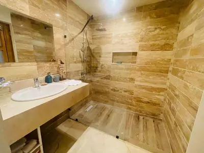 a bathroom with a sink and a shower at Modern 2 Queen Beds Apartment with Garden View in Puerto Plata