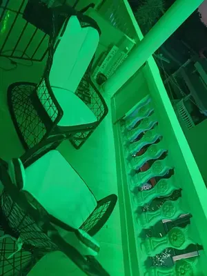 a green closet with shoes in it at Dona Beba Guesthouse in La Caleta