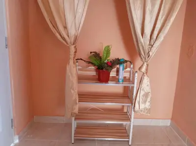 a staircase with a potted plant in a room at Dona Beba Guesthouse in La Caleta